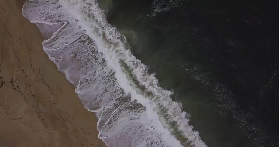 Waves crash onto the shore