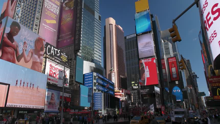 City buildings covered in billboards and advertisements