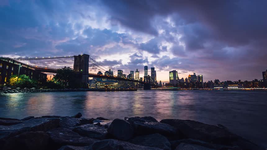 The sun sets over the city ahead