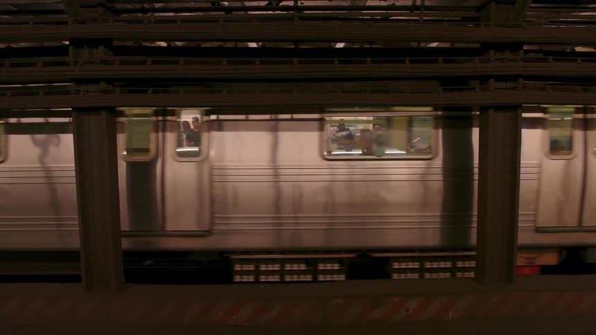 A subway train pulls off