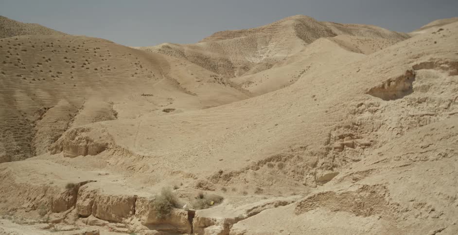 A desert landscape is empty and still during the day