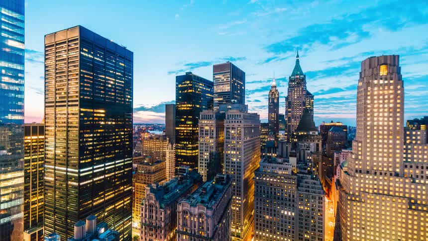 Skyscrapers in a city lit up at night