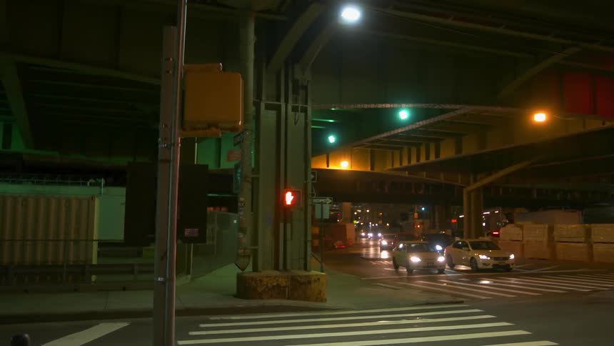 A truck travels through the intersection as opposing traffic waits