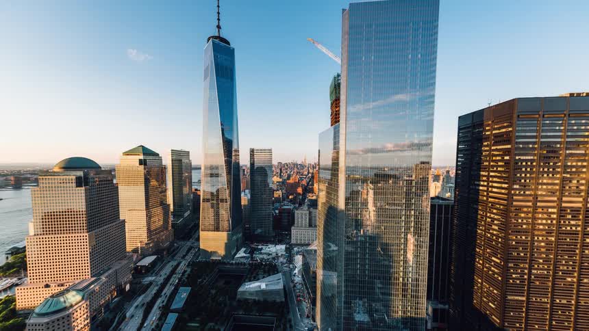 Clouds float over city skyscrapers