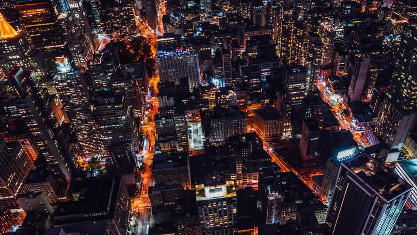 A time lapse of a big busy city is filmed from a skyscraper