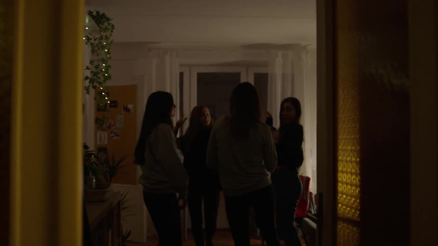 Women are partying down the hall together