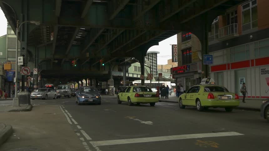 Many cars travel under the overpass