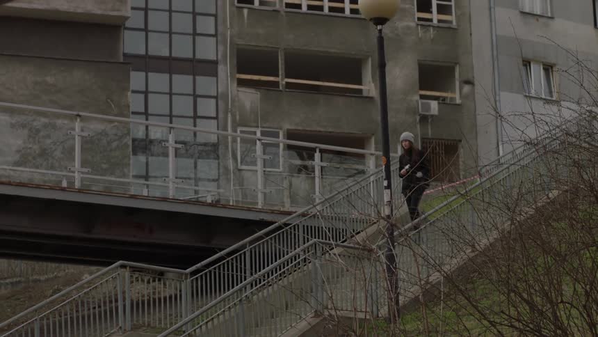 Person walking down a large staircase