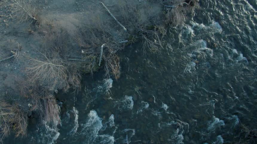 Water flows rapidly down a stream