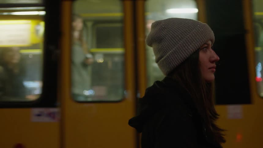 Woman watching a train pass by