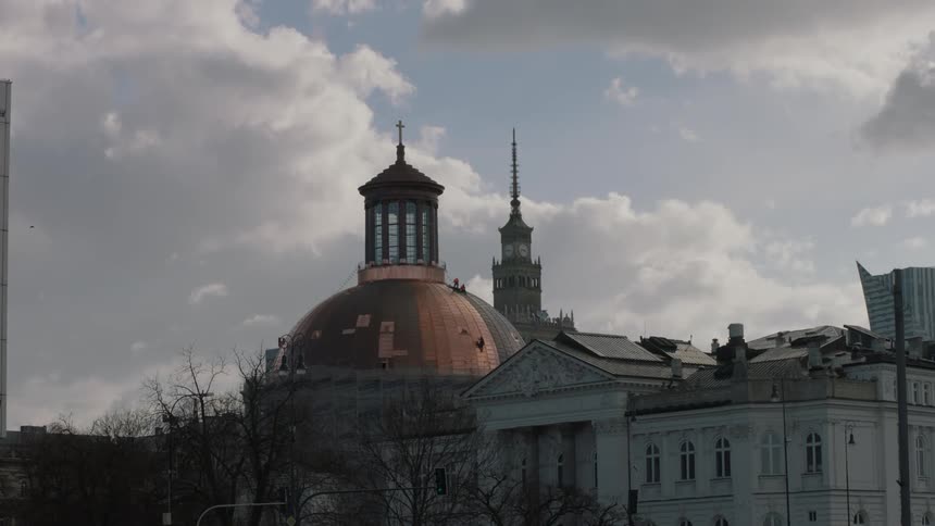 A building with partial copper covering stands tall