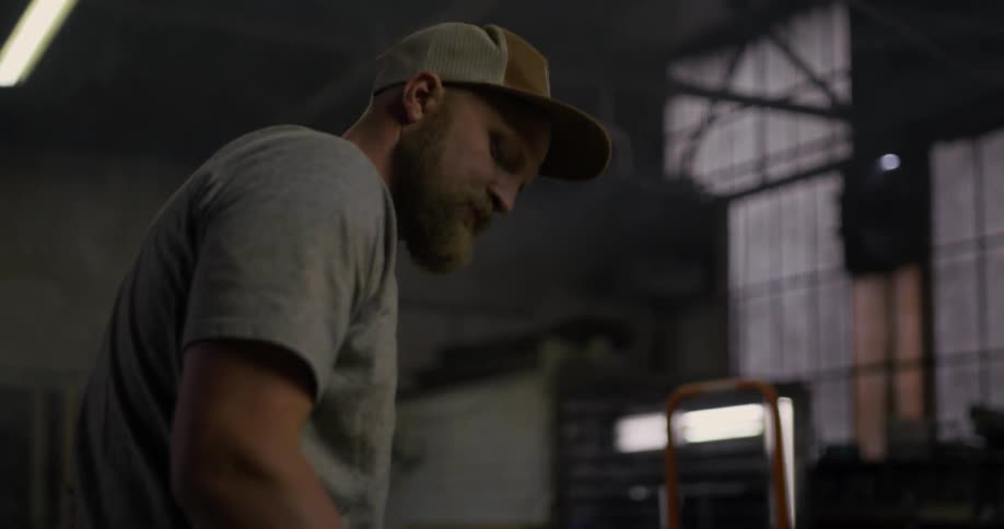 A wood worker works in a workshop