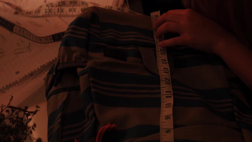 Person using a tape measure to do some work