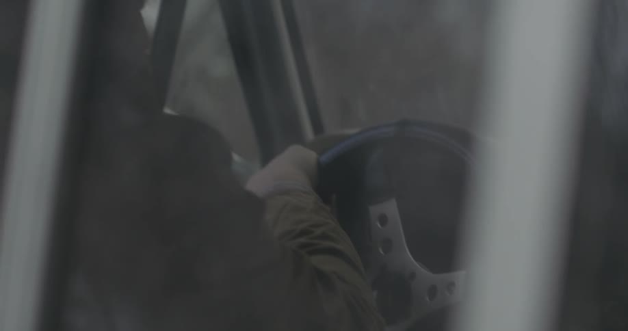 A man drives an old pickup truck