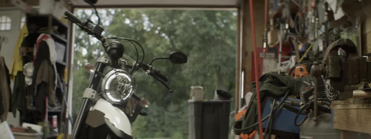 A motorcycle is parked in a garage