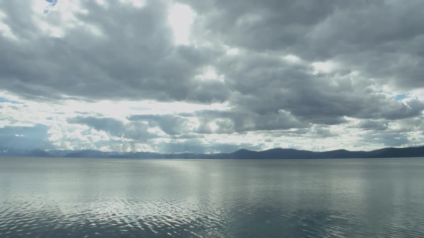 White clouds over shimmering water