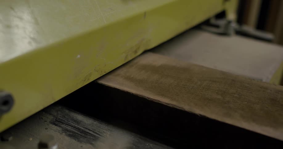 Wood being fed into a large machine