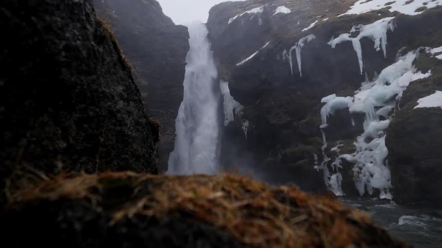 Water falls down the cliff