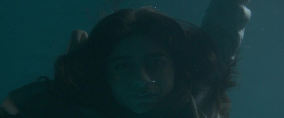 A girl is floating down drowning