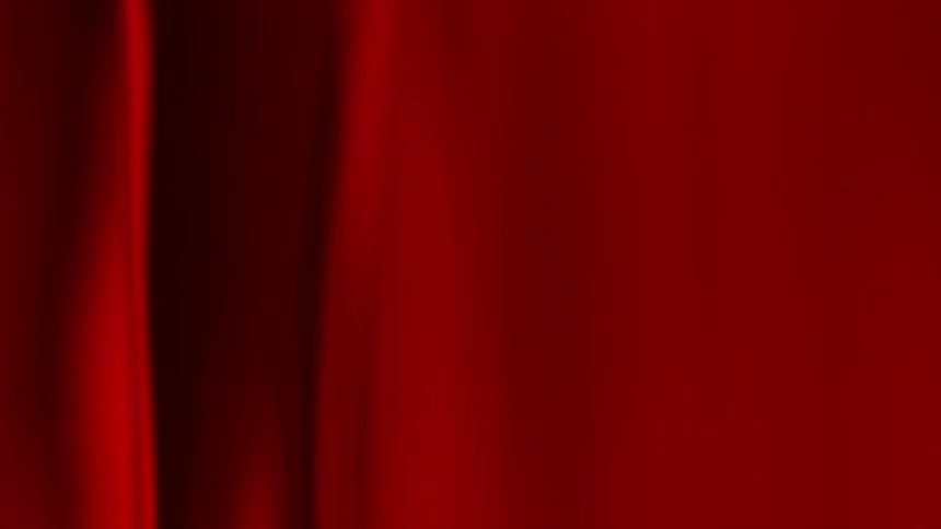 A red substance flows and undulates with light and shadow