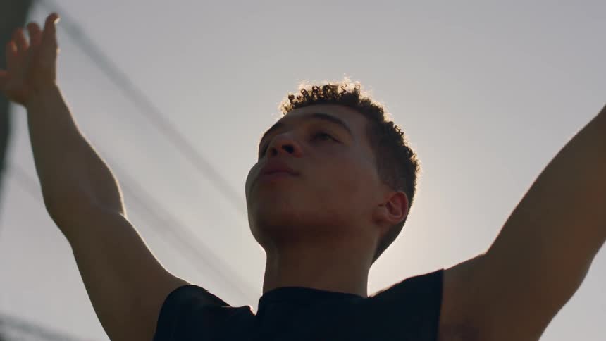 A man stretches outside