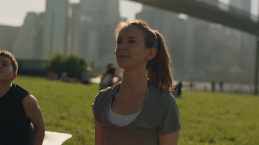 People are doing yoga on a sunny day