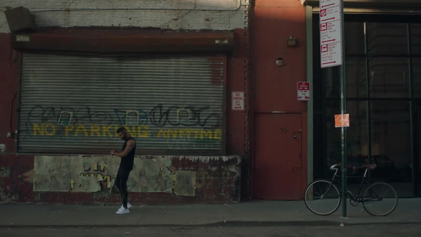 A man jogs down a city street