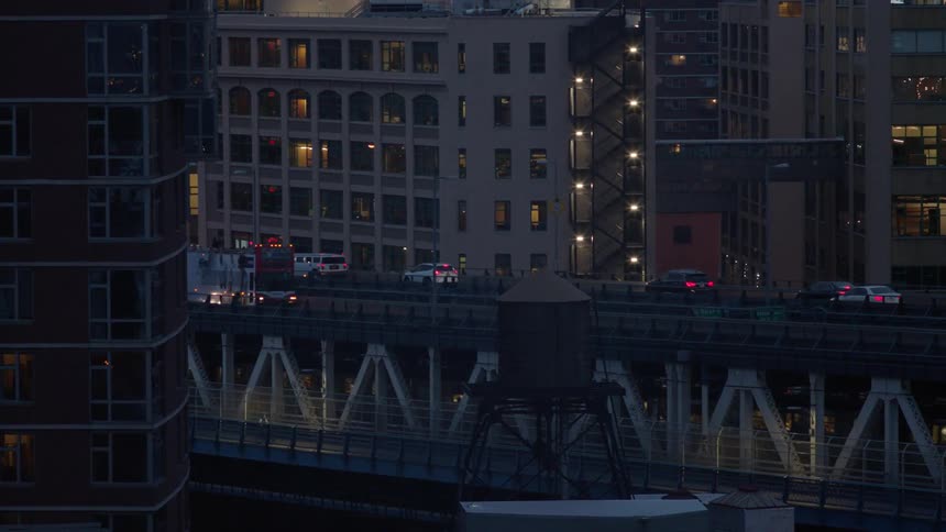 Traffic travels over a bridge at night