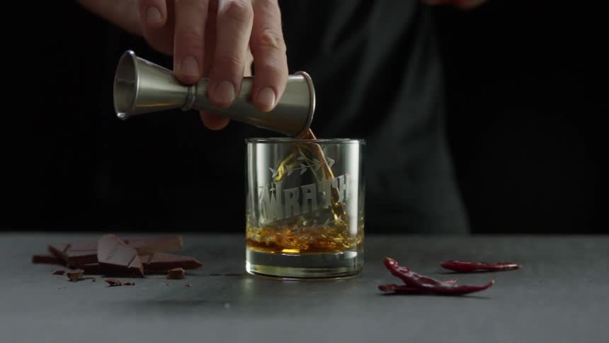 A person is preparing a drink