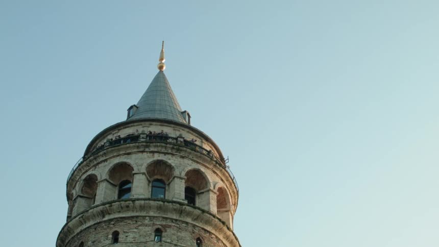 Birds fly above a tall building