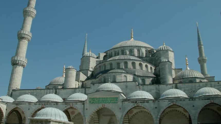 Large ornate building sits under a blue sky