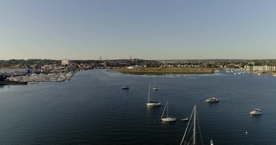 Sailboats travel along the waterway