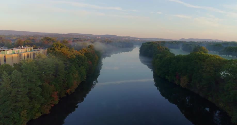 A drone is flying over a small river