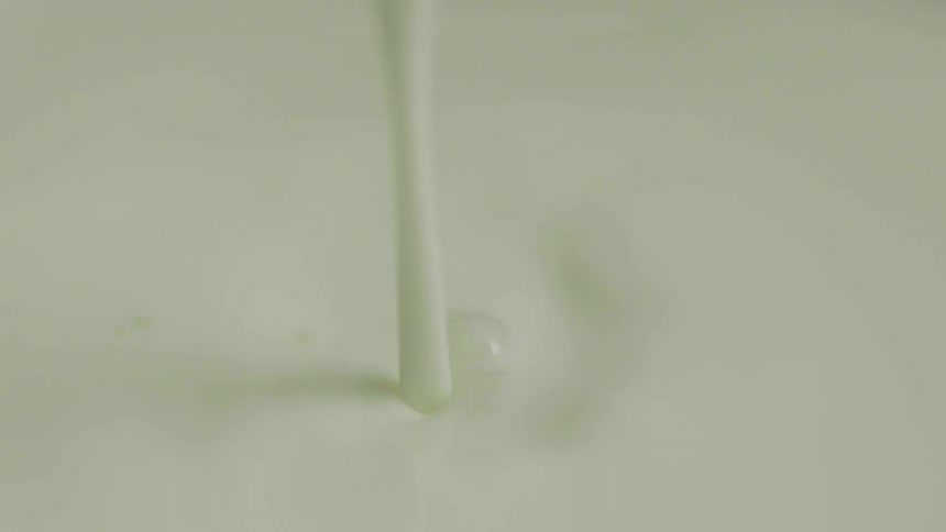Cream splashes up as it is poured