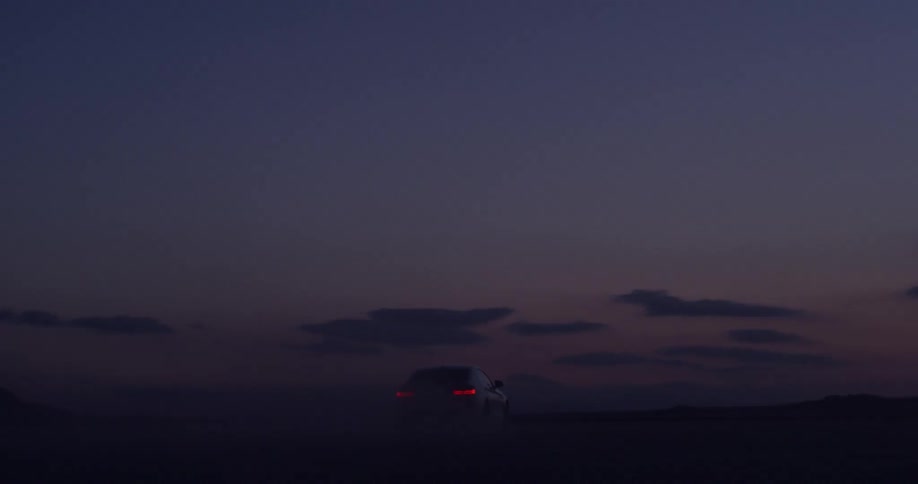 A car driving after sunset