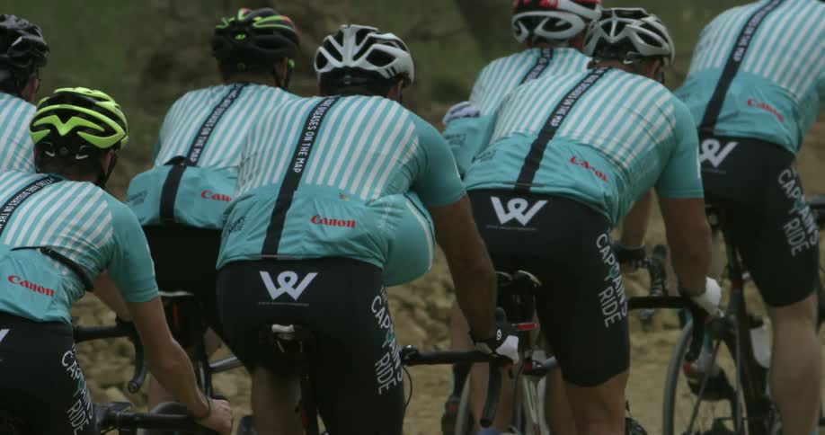 Bicyclists ride together in a group