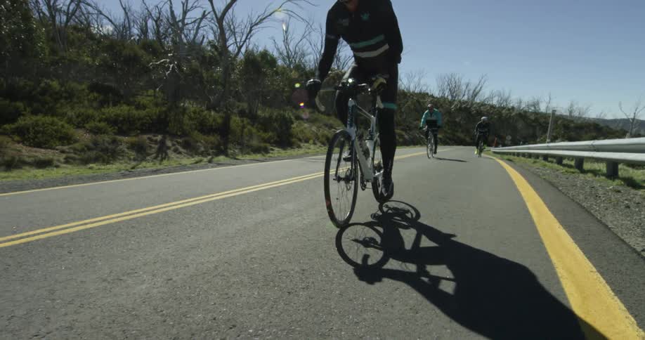 Bicyclists ride town the road