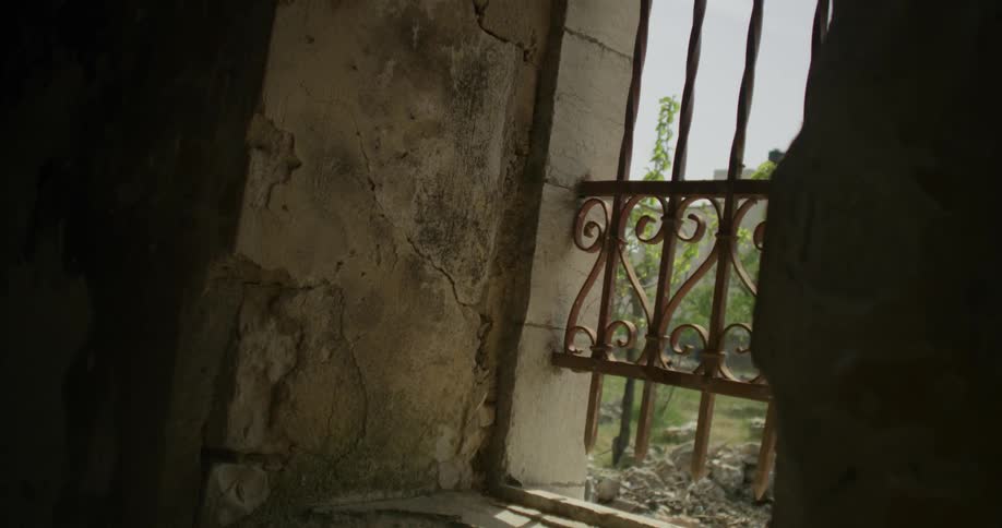 Painted over iron bars blocking a window