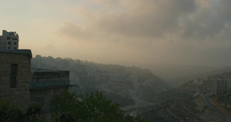 Haze lifts above a mountain town