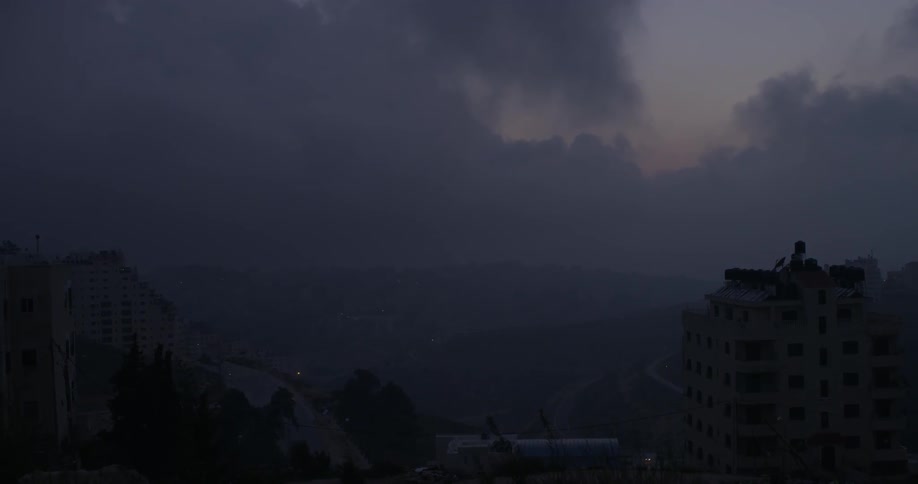 Tall building stands in the darkness
