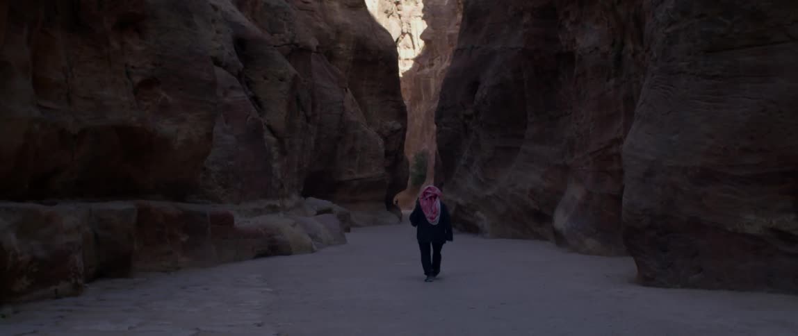 People walk through a cavern