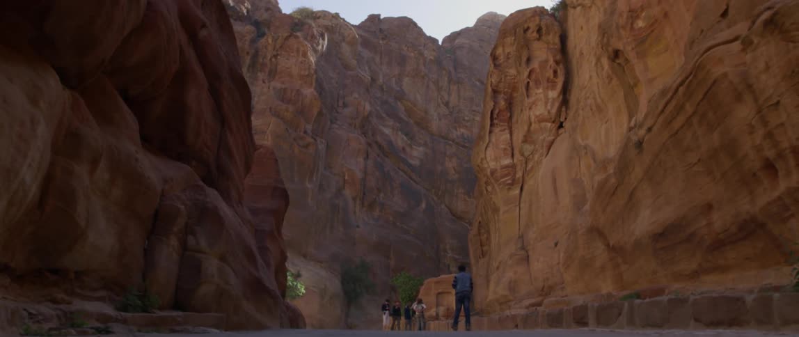 Tourists walk through a cavern