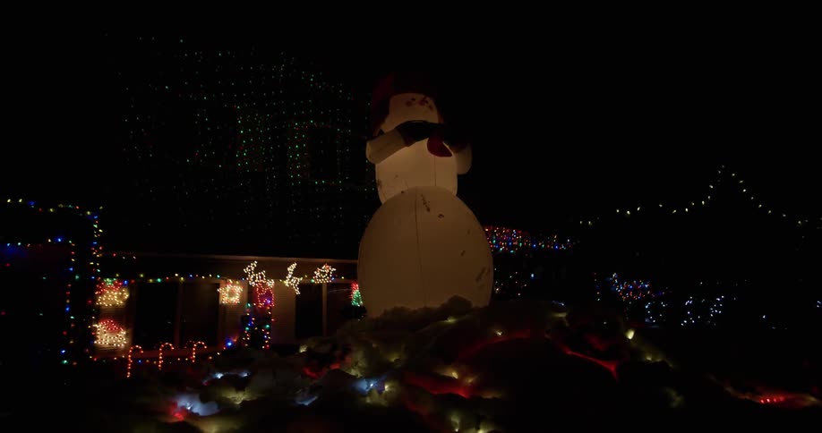 Christmas lights and decorations illuminate the night