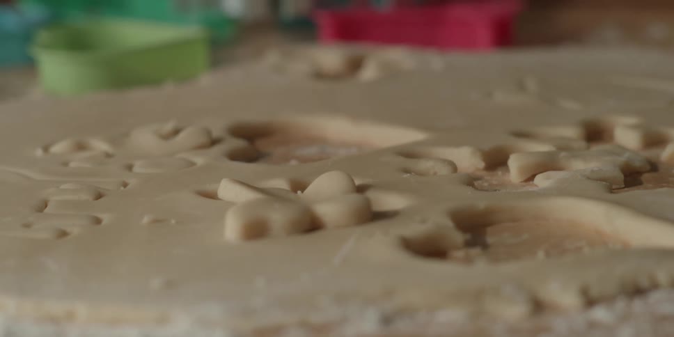 Hands mold cookie dough into shape