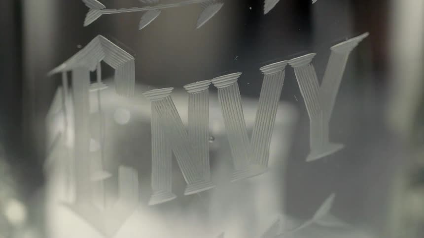 Ice cubes are dropped in a glass