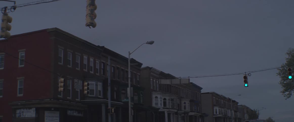 A city is shown at dusk