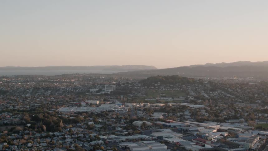 The sun sets over a city