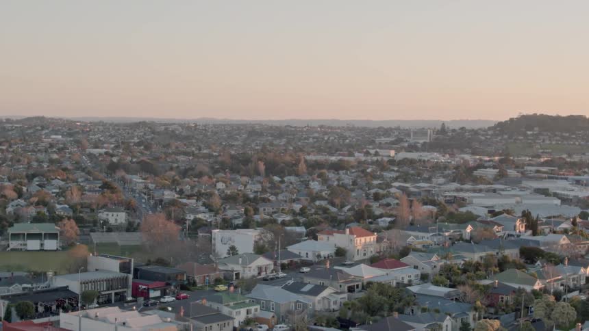 A residential area is shown at sunset