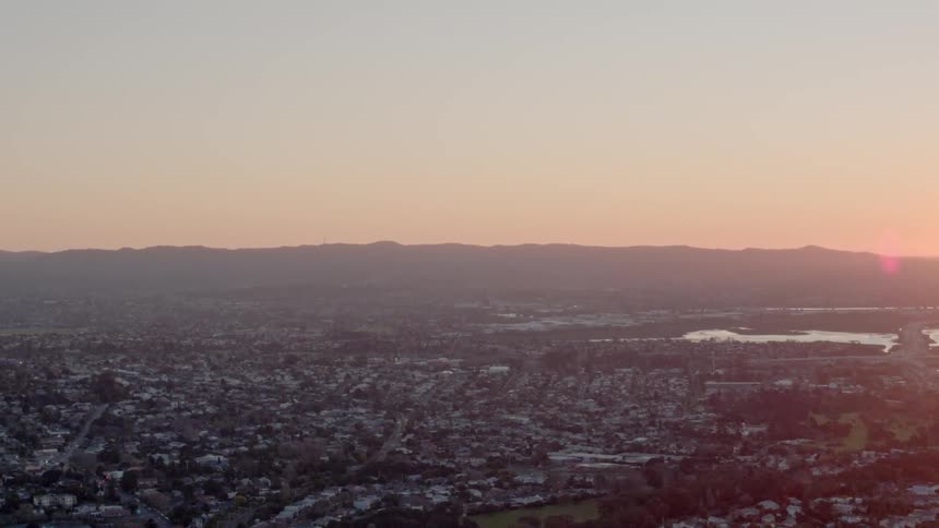 The sun sets on a large city