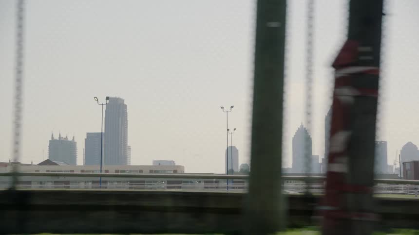 The city is covered in fog behind this bridge